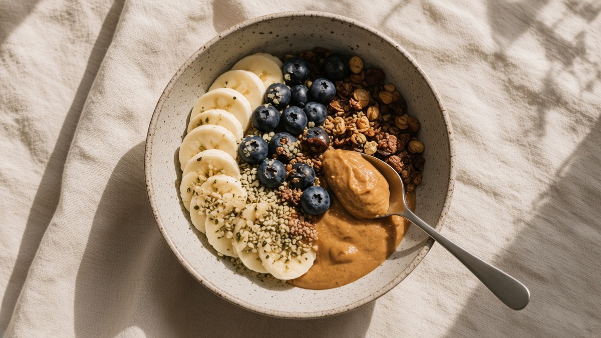 A composed breakfast bowl of banana, berries and oats